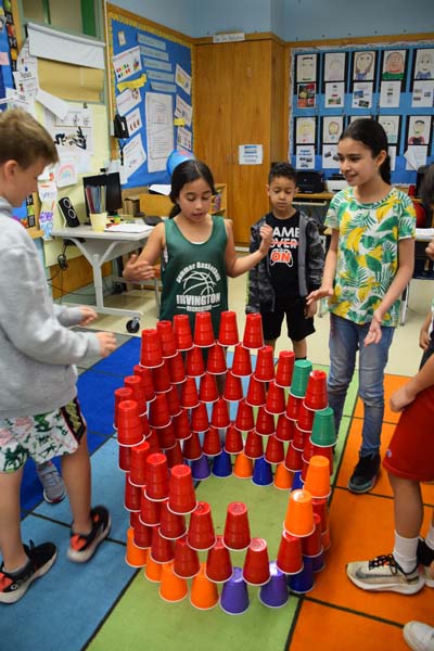 Students in the Classroom with cups